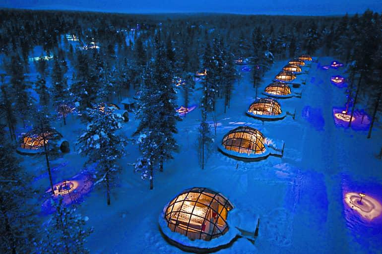 The glass igloos at Kakslauttanen Arctic Resort are lined up among the forests in Finnish Lapland.