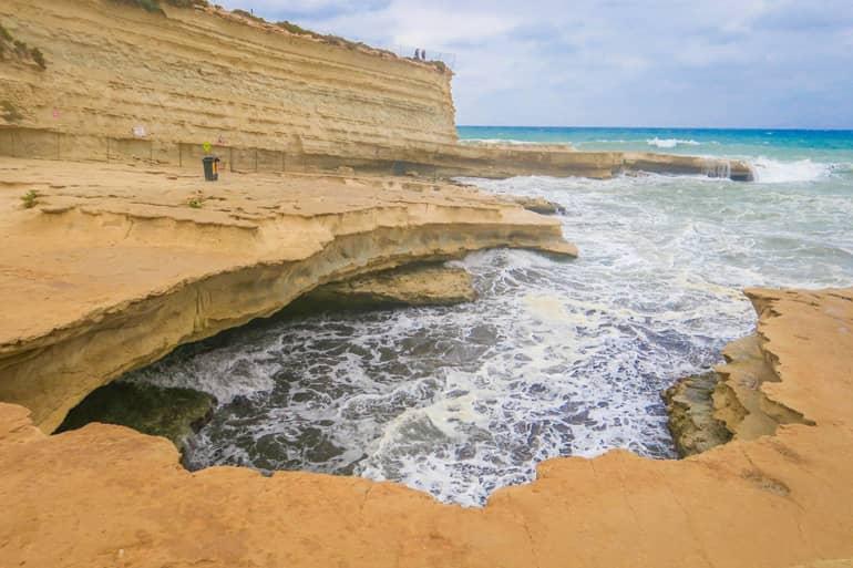 View of St. Peter's Pool - a natural swimming pool near Marsaxlokk