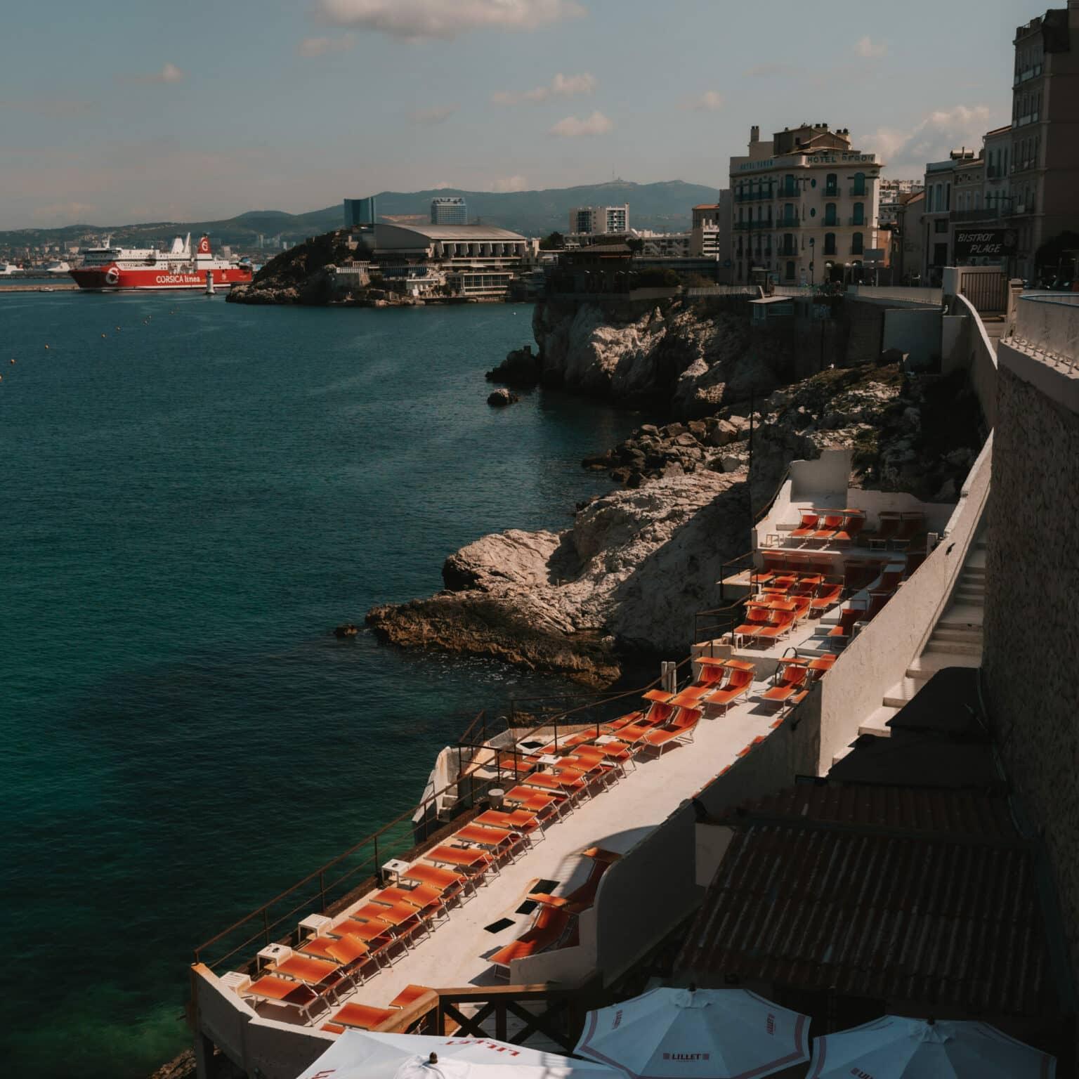 View of a coastal section with sun loungers in the city of Marseille.