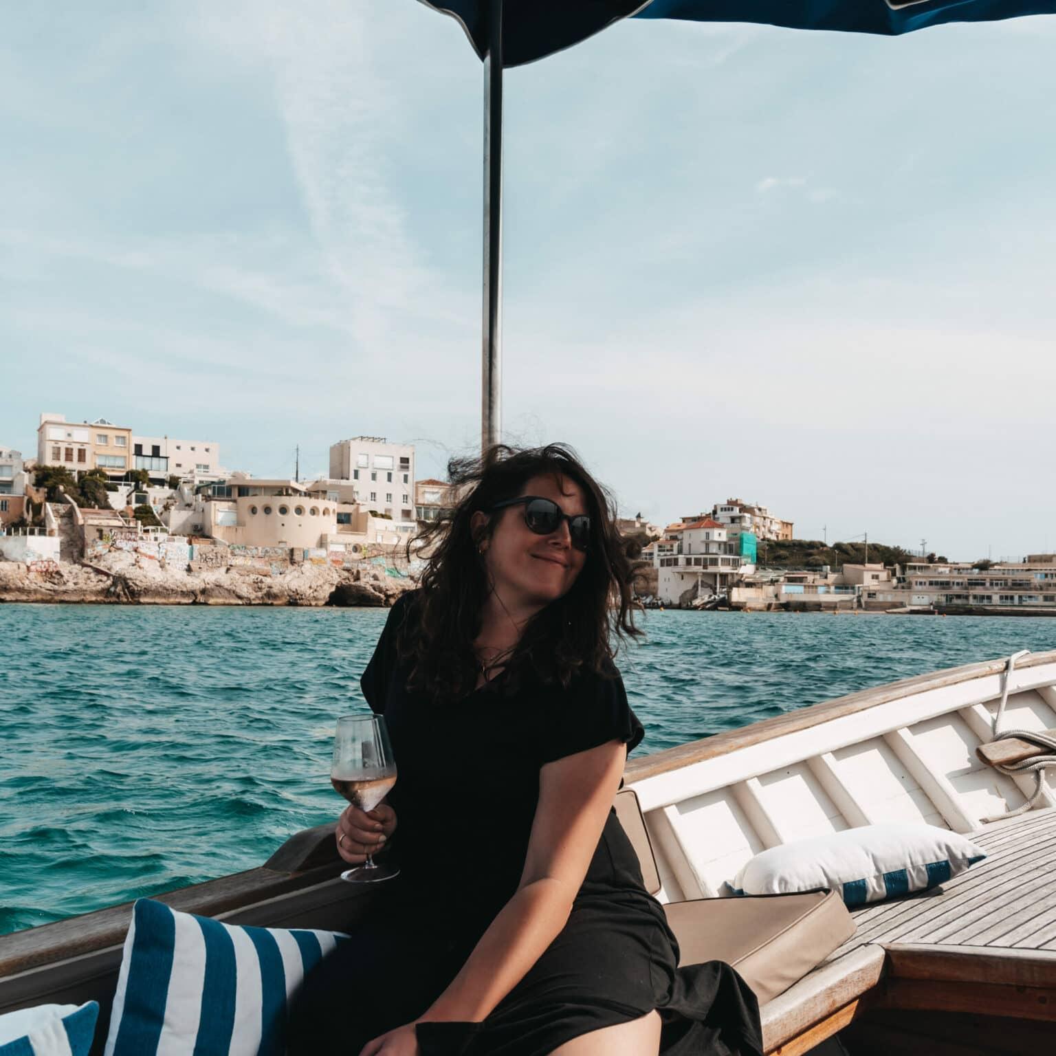 Blogger Laura on a boat off the coast of Marseille.