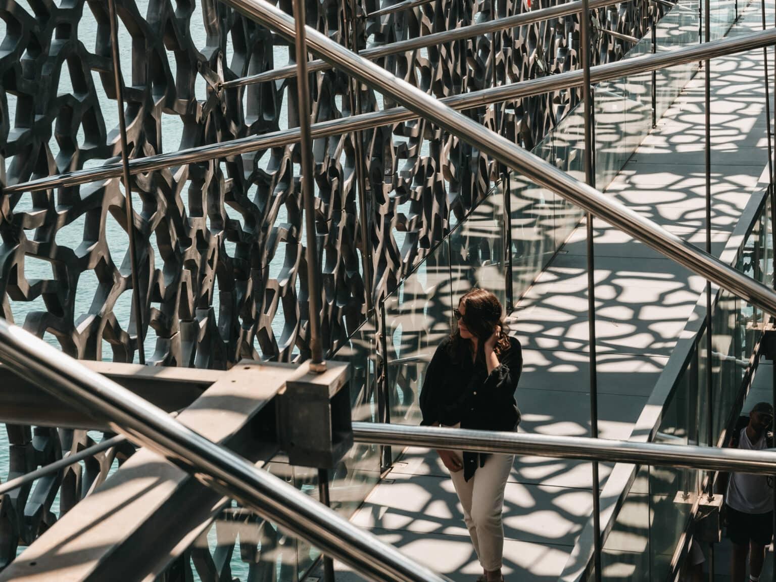 Blogger Laura walking through the halls of Mucem in Marseille.