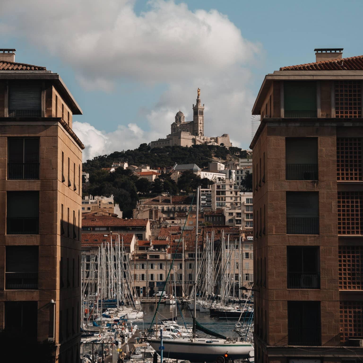 View from the city of the landmark La Bonne Mère on a hill.