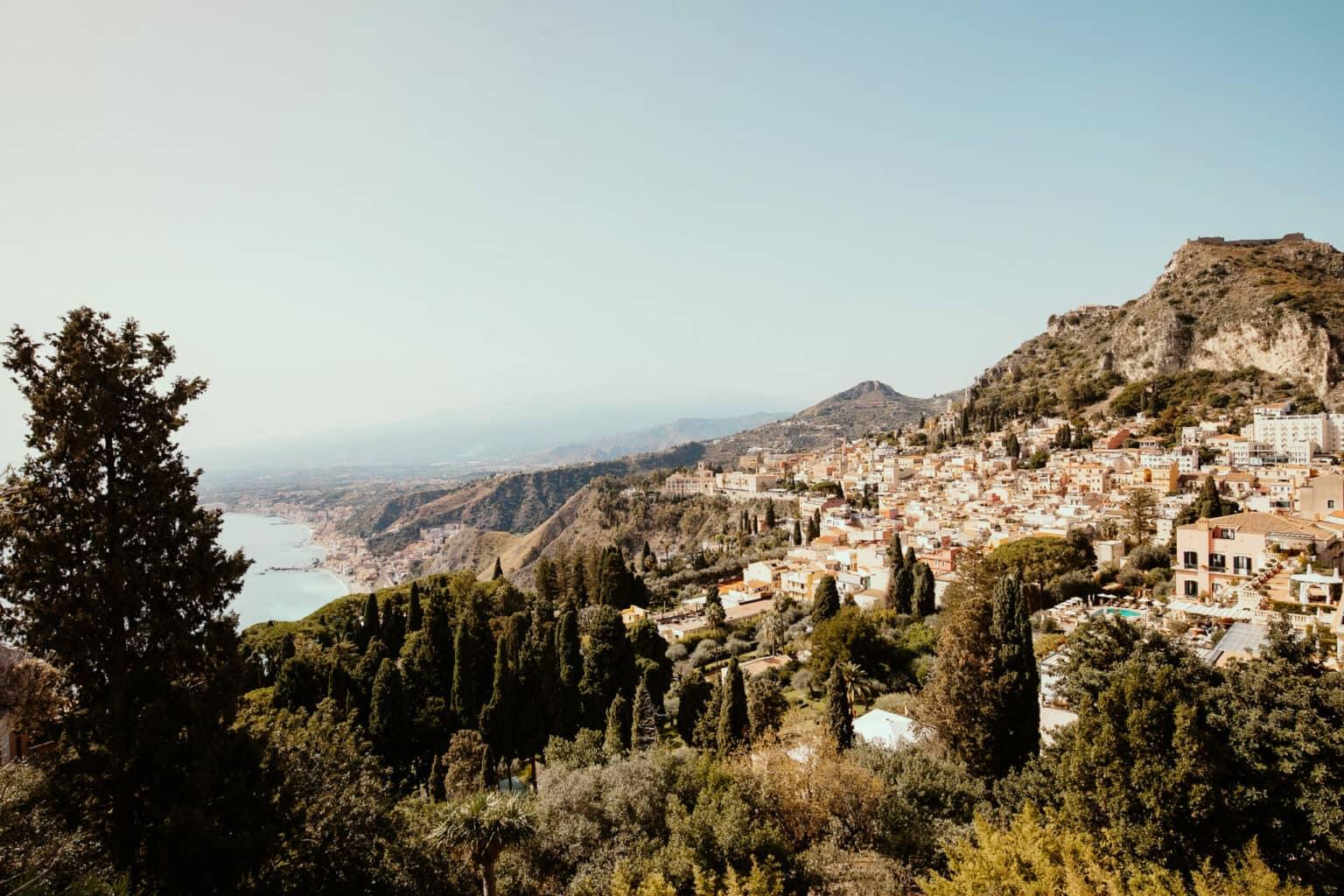 View of the beautiful town of Taormina by the sea.