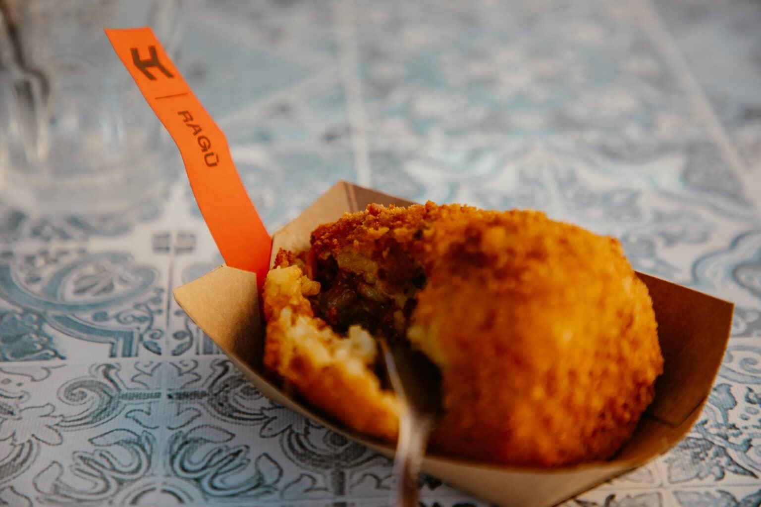 The specialty Arancini on a small plate.