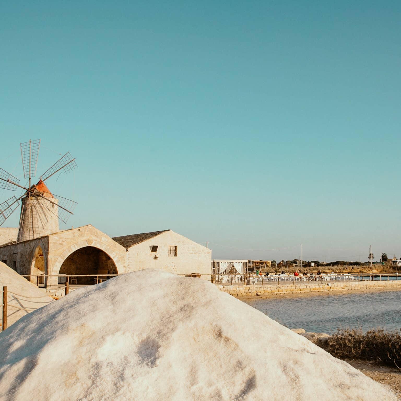 The salt pans of Trapani, with a small windmill in the middle.