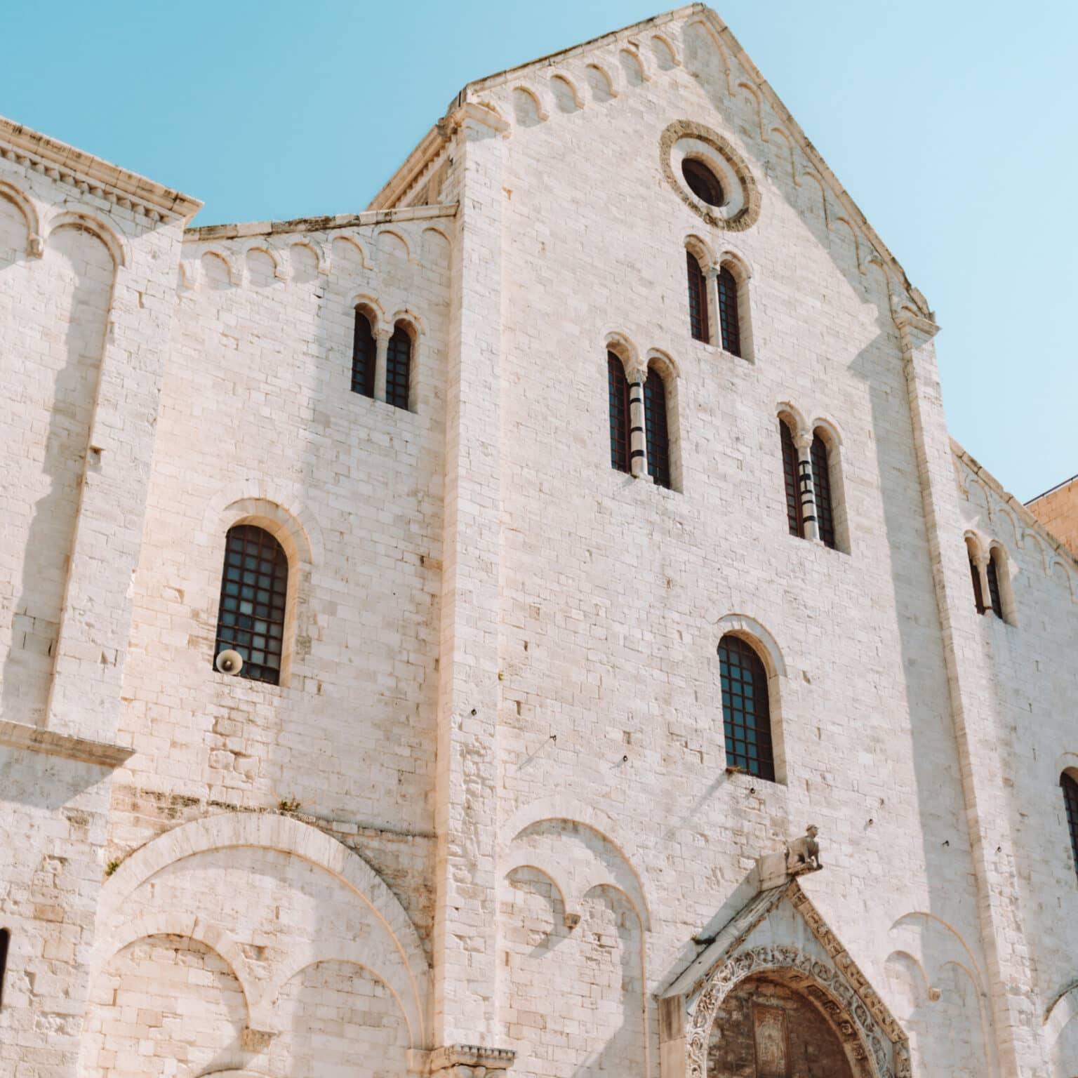 The Basilica of San Nicola in Bari with its bright beige stone facade.