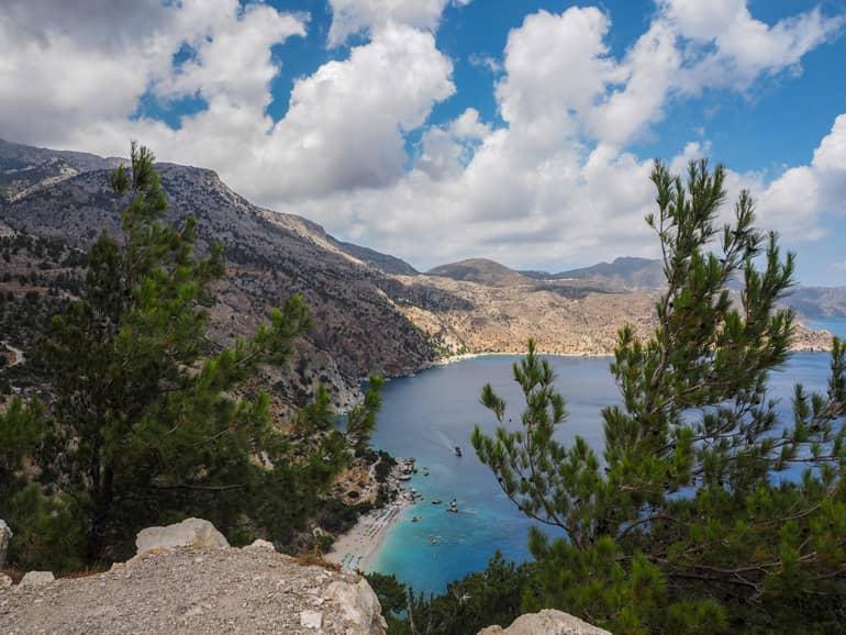 One of the most beautiful beaches in Karpathos is the award-winning Ápella Bay, nestled between rugged mountain slopes.
