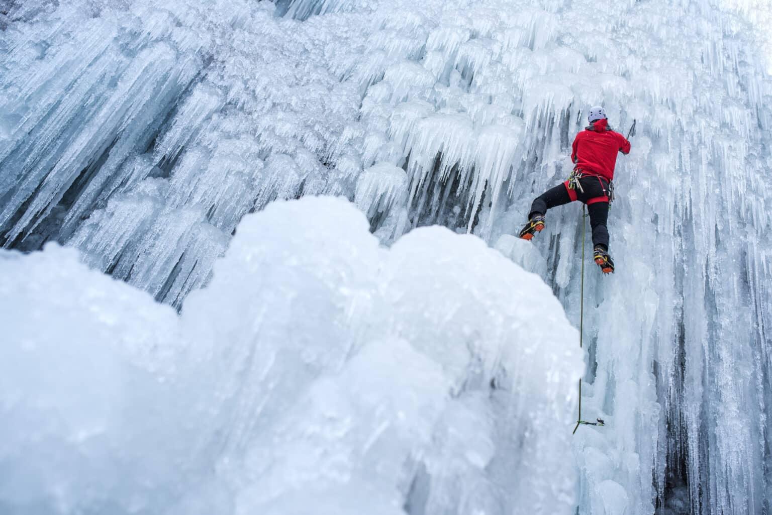 A climber scales an ice wall.