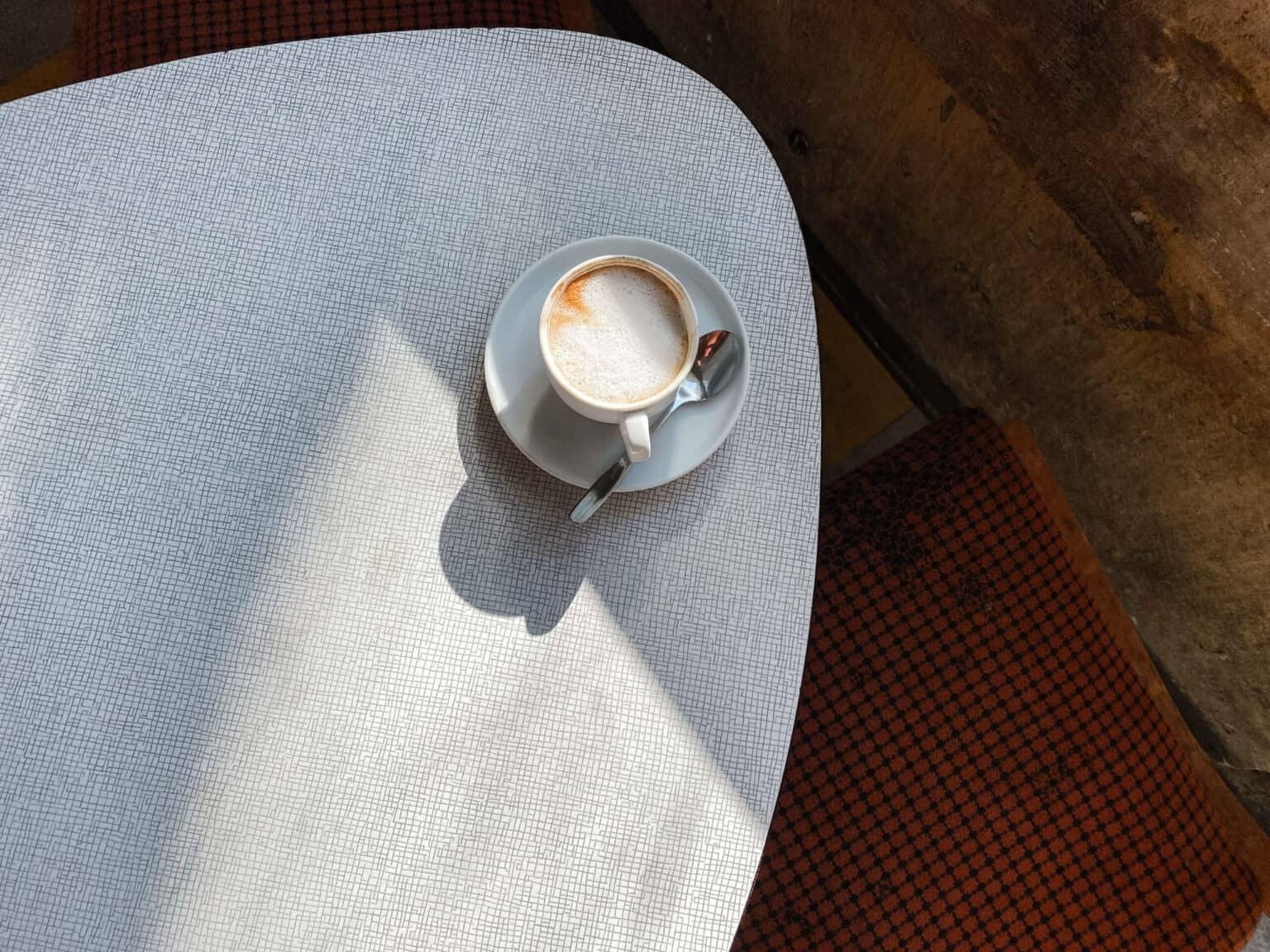 A coffee on a table in Café Kosmos in Munich.