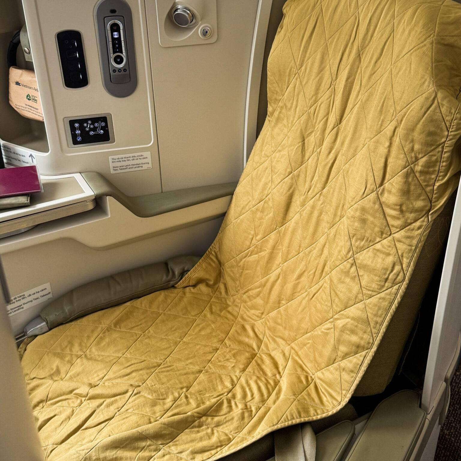 The seat in Vietnam Airlines Business with mattress pad.