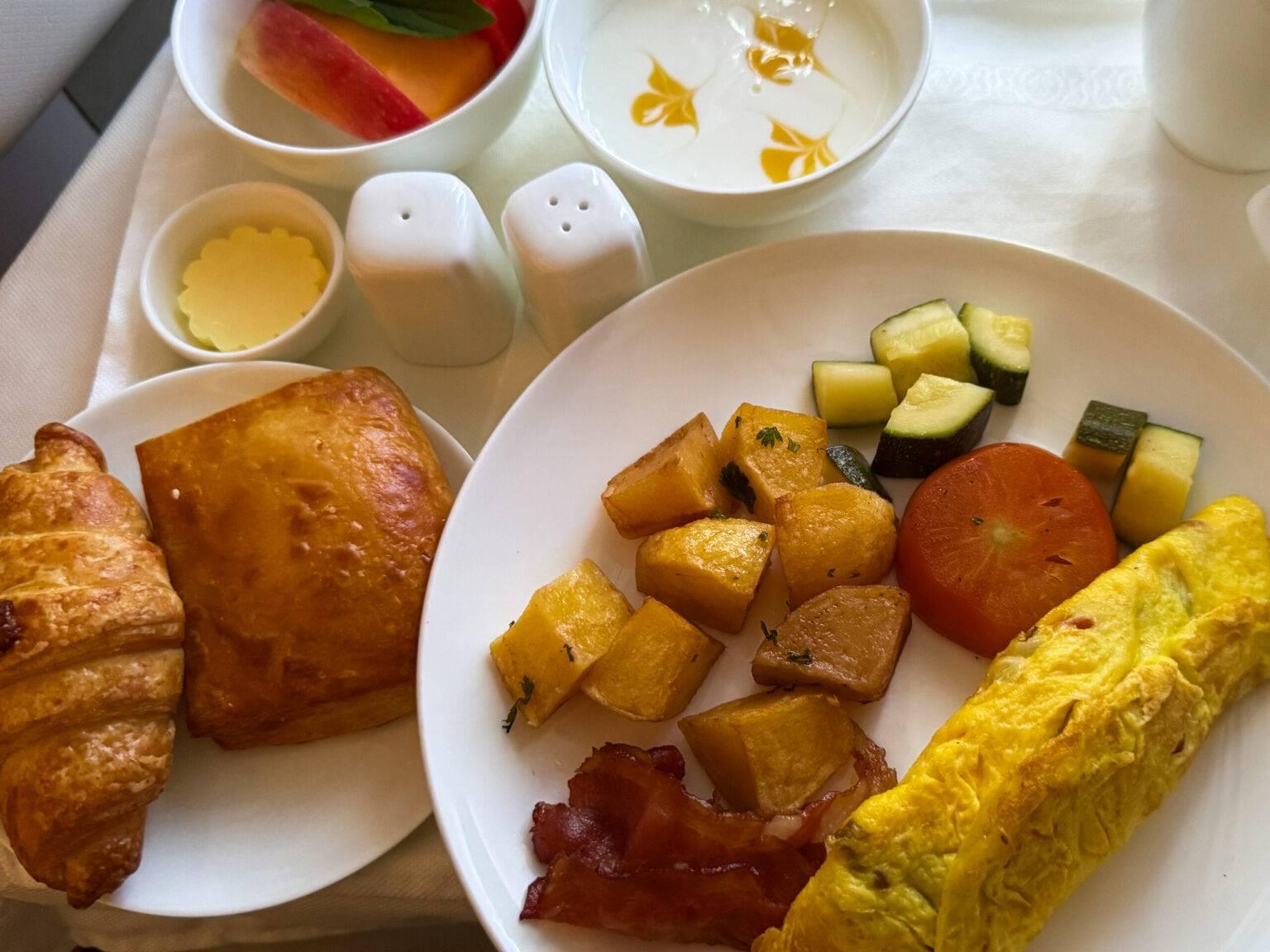 Omelet on a plate in the airplane from Vietnam Airlines.