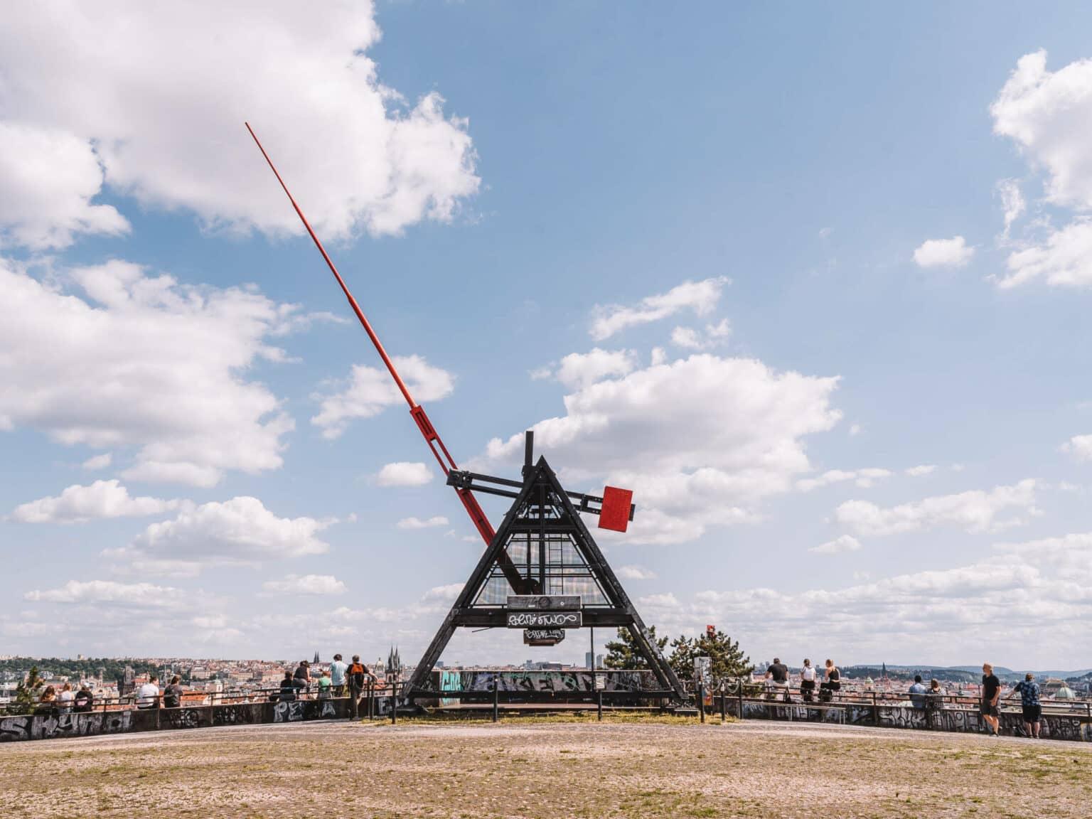 The Metronome in Letná Park above the rooftops of Prague.