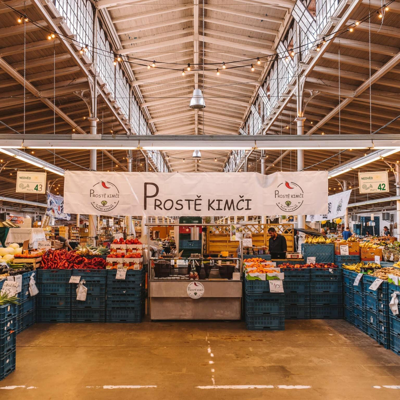 The market hall of Havel Market in Prague with plenty of fruits and vegetables.