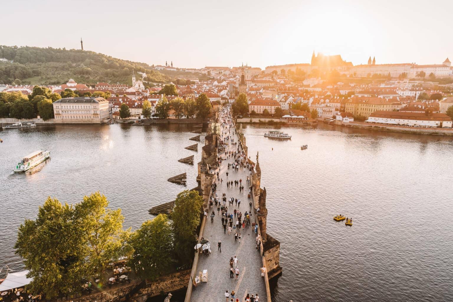 View from the Old Town Bridge Tower in Prague over the city at dusk.