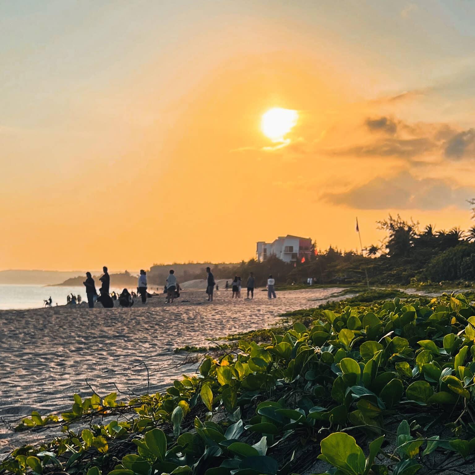 People watching the sunset on Dawan Beach in Taiwan.