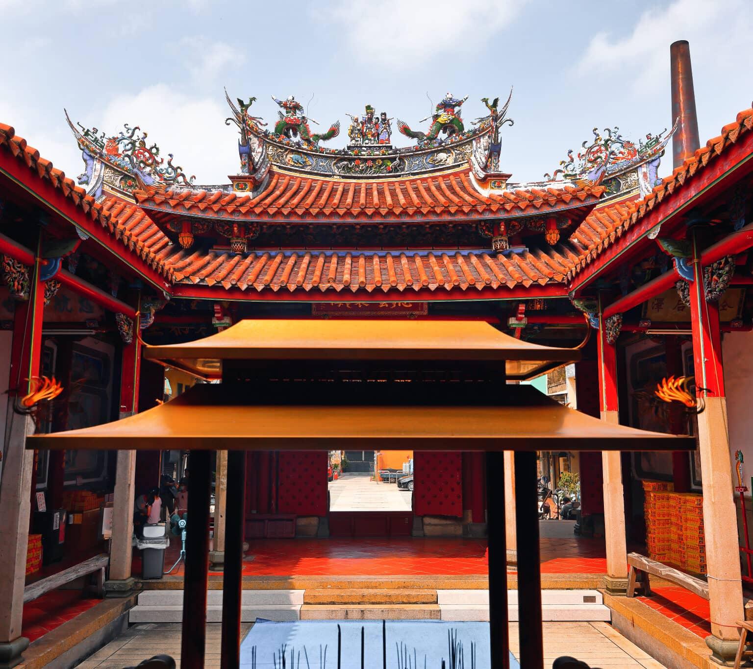 The courtyard of the Mazu Temple illuminated in vibrant colors.