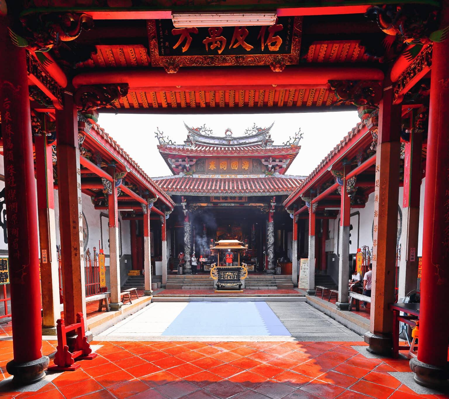 The interior of the Mazu Temple is lined with bright red columns.