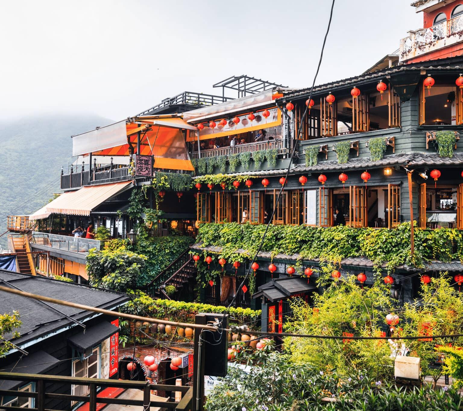 The houses in the mountain village of Jiufen in Taiwan are decorated with orange lanterns.