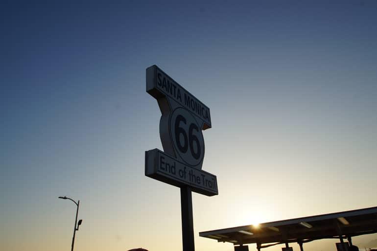 A street sign with the number 66 at sunset in Santa Monica.