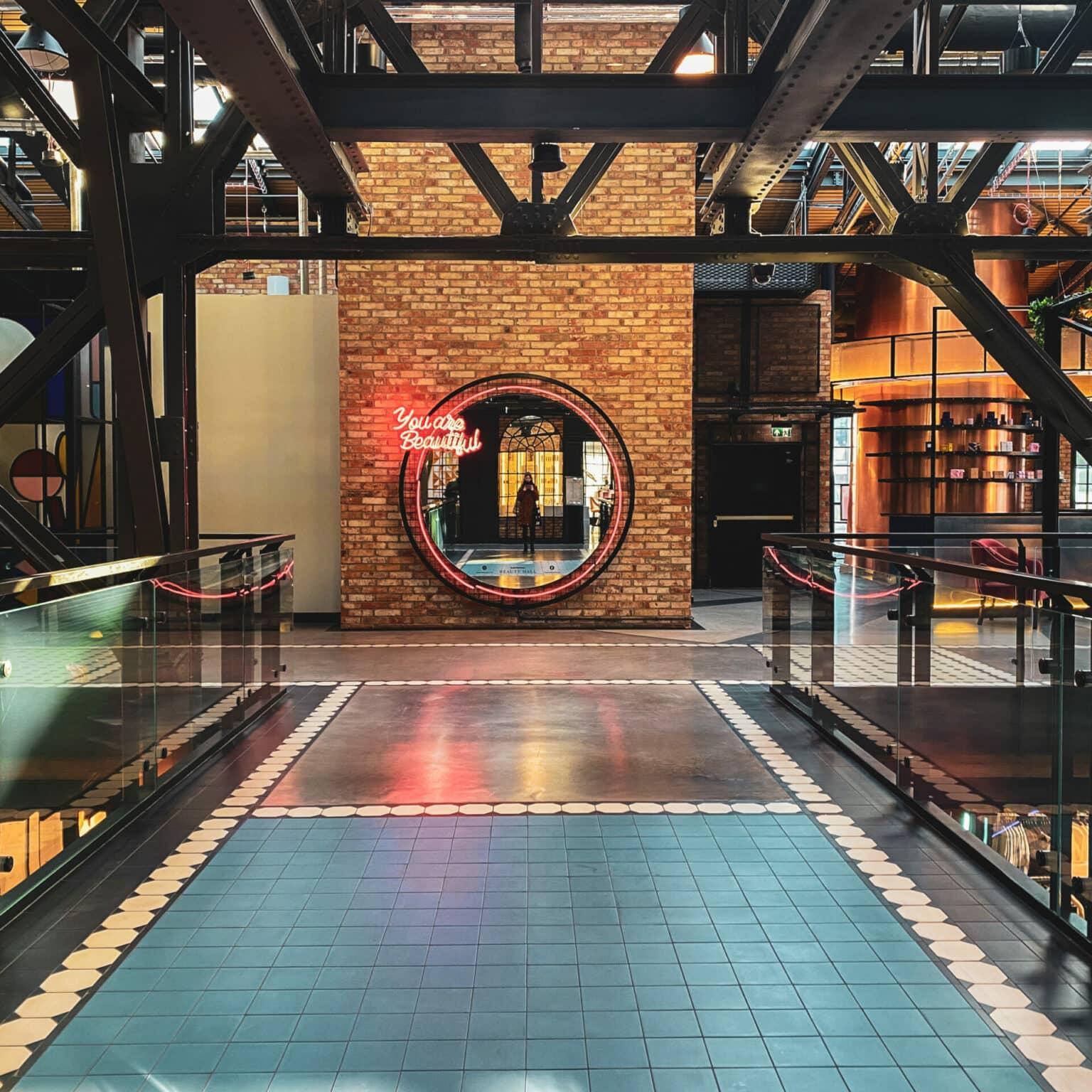 A large mirror hangs in the Elektrowina shopping mall.