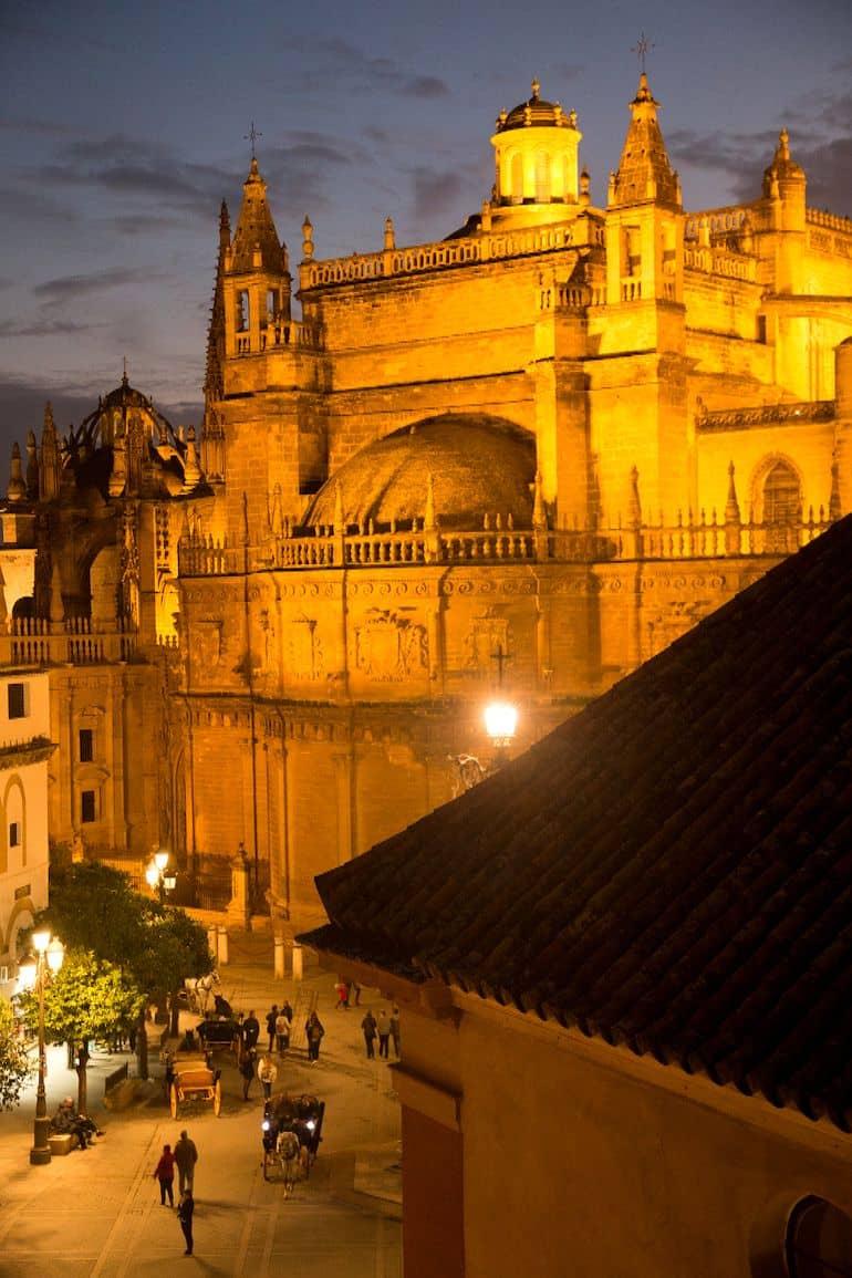 The rooftop terrace of Hotel Doña Maria in Seville has a beautiful view of the cathedral.