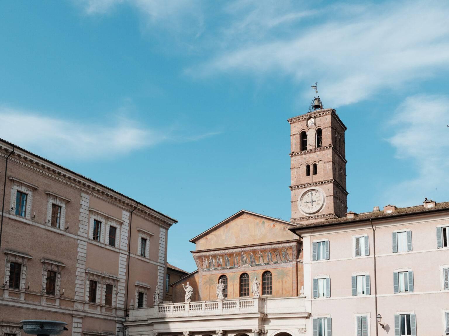 Piazza Santa Maria in Trastevere with the eponymous basilica in daylight.