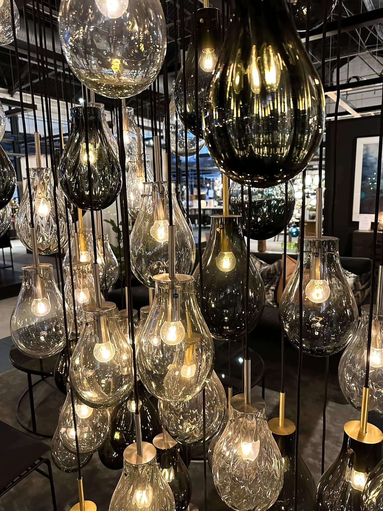 Glass lamps hanging from the ceiling in the glass factory Hadeland Glasverk