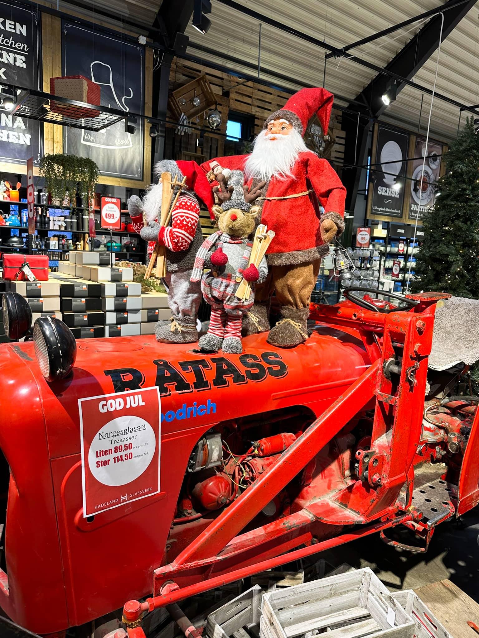 Christmas figures on an old red tractor at the glassworks Hadeland Glasverk.