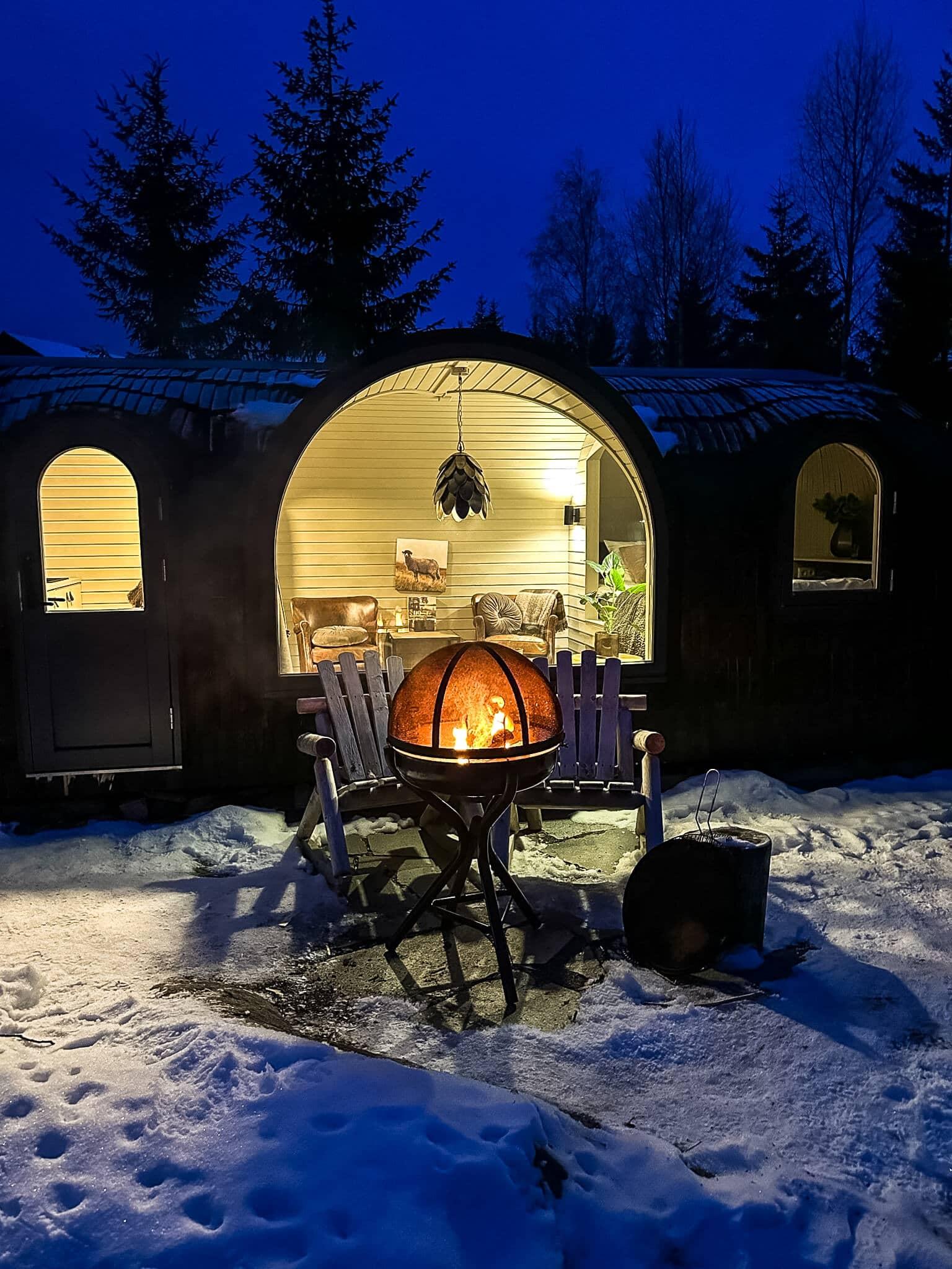 A campfire in front of the Konglehytten at Villa Heidi.