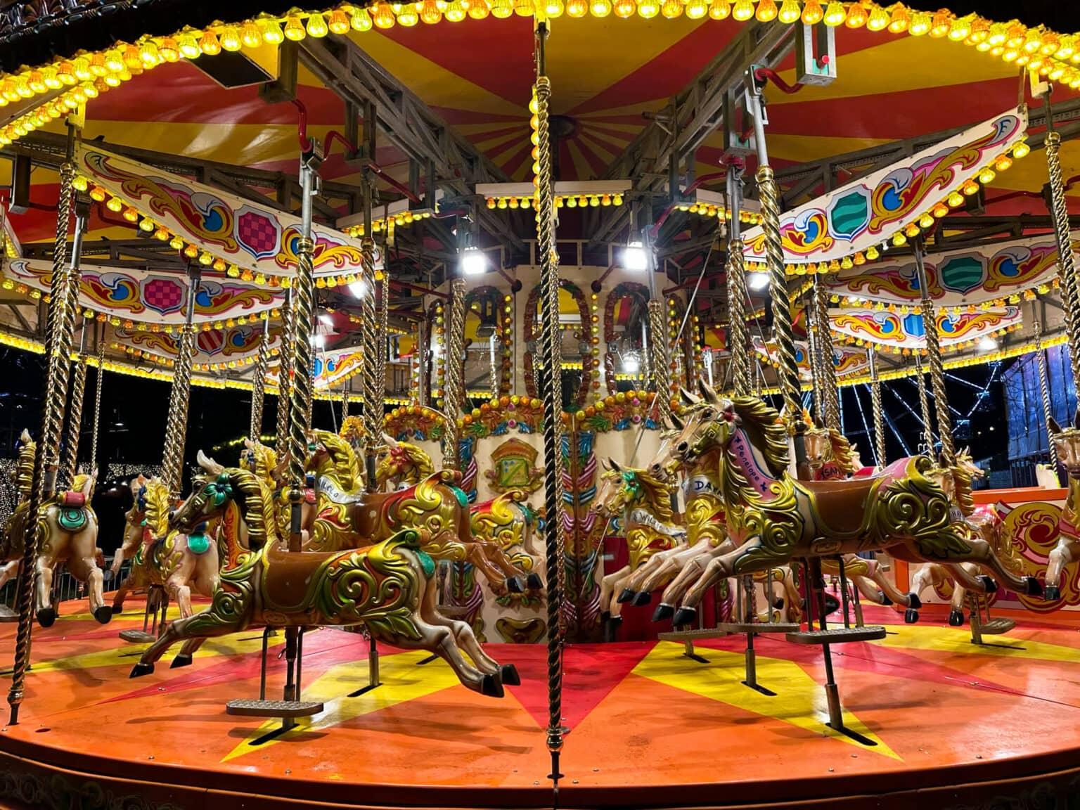 An old carousel with horses at the Christmas market in Oslo