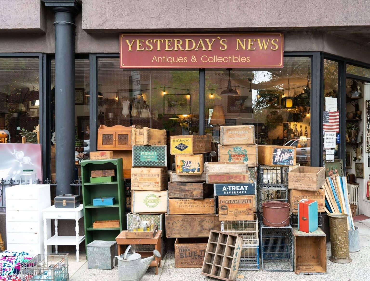 In front of the antique store "Yesterday's News" in Carroll Gardens, stacks of old wooden boxes in various colors and sizes are piled up.