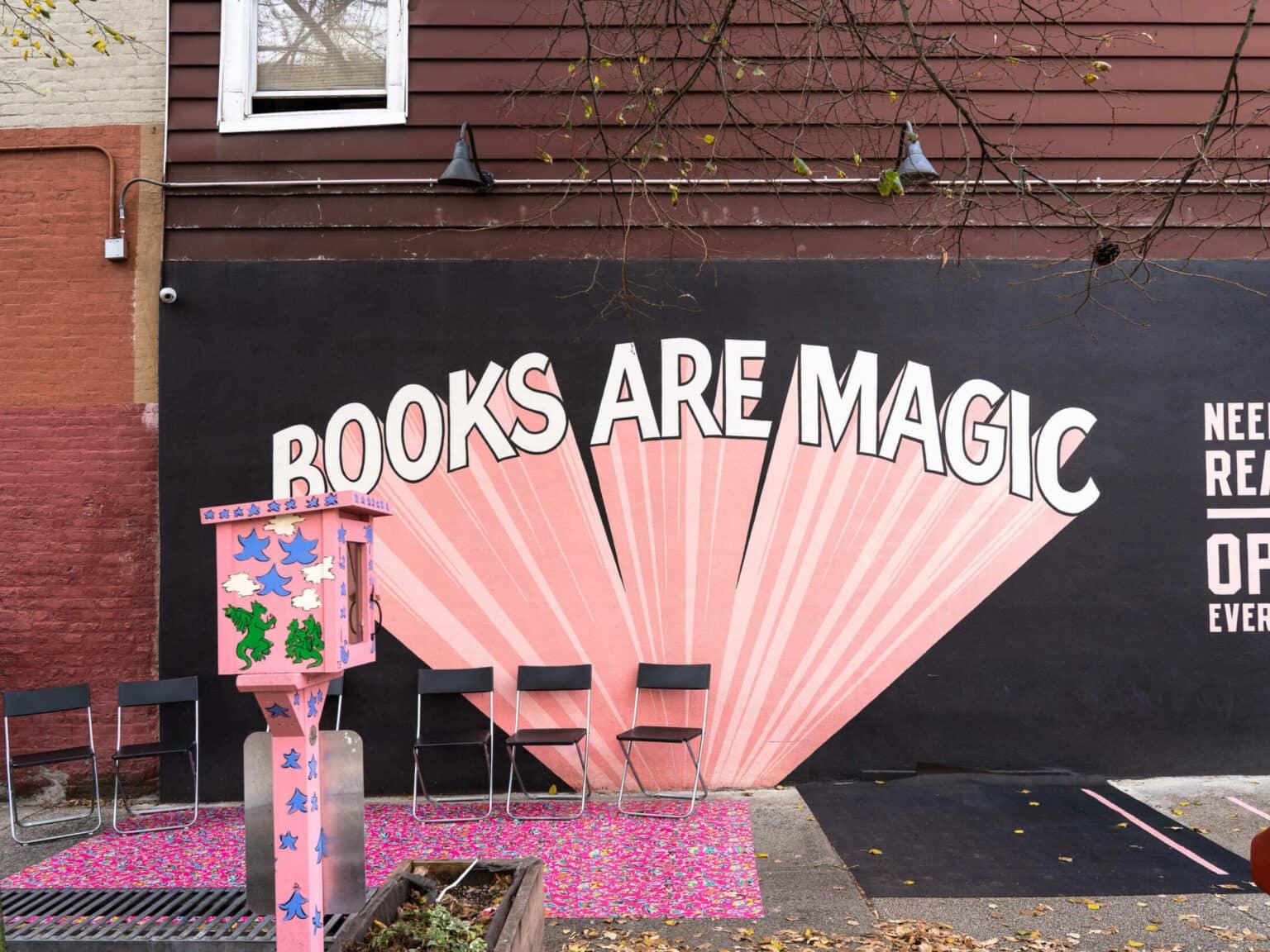 The words "Books are Magic" graffitied on a wall in Brooklyn.