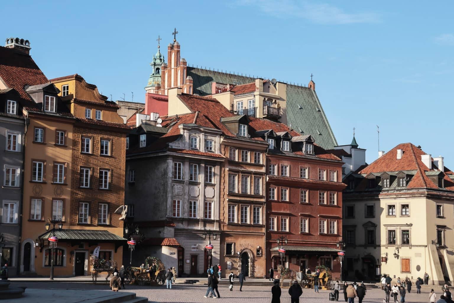 Colorful houses frame the market square in Warsaw's Old Town.