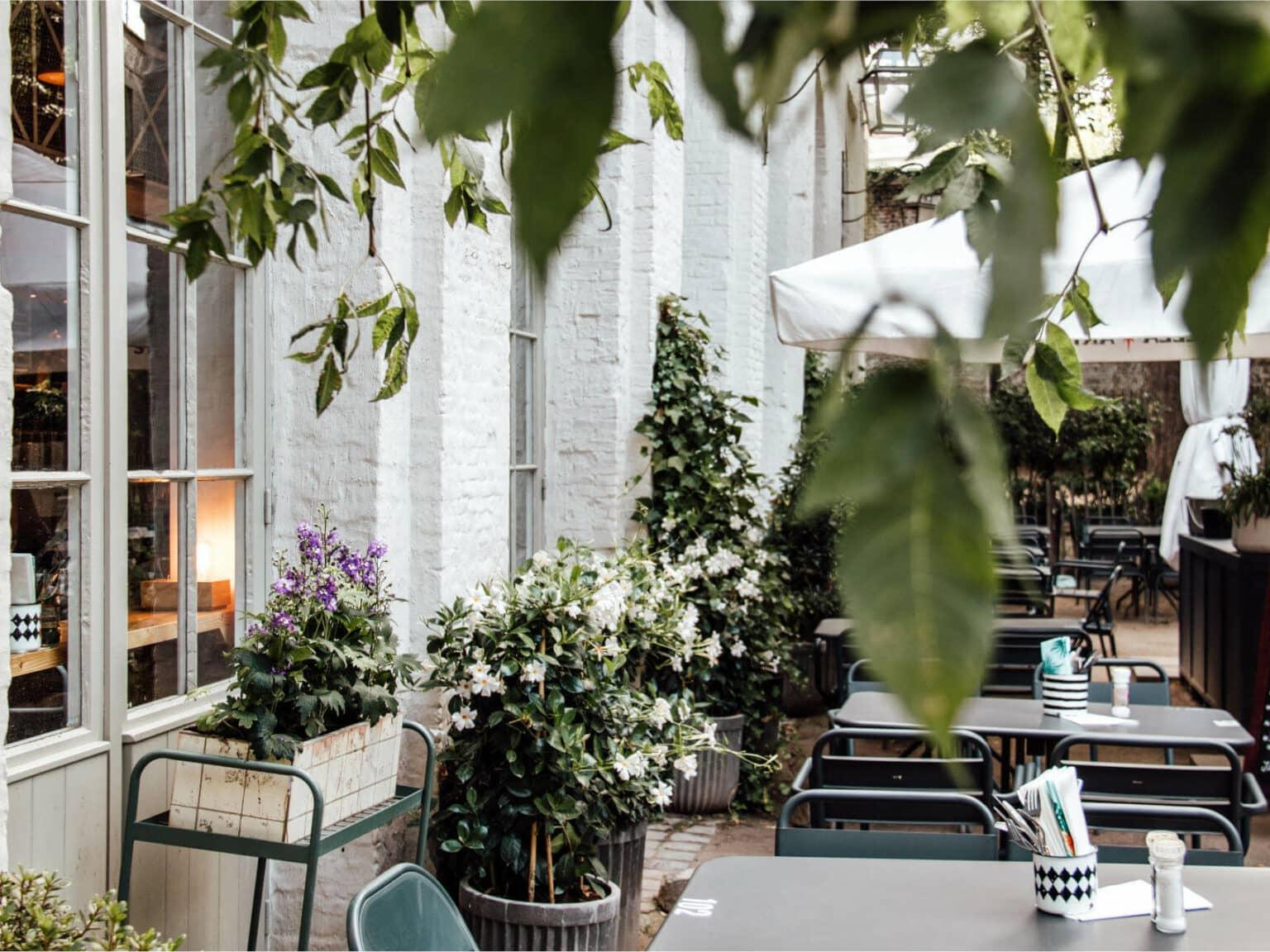 The restaurant La Fabrique en Ville offers dining inside and outside in an idyllic setting.