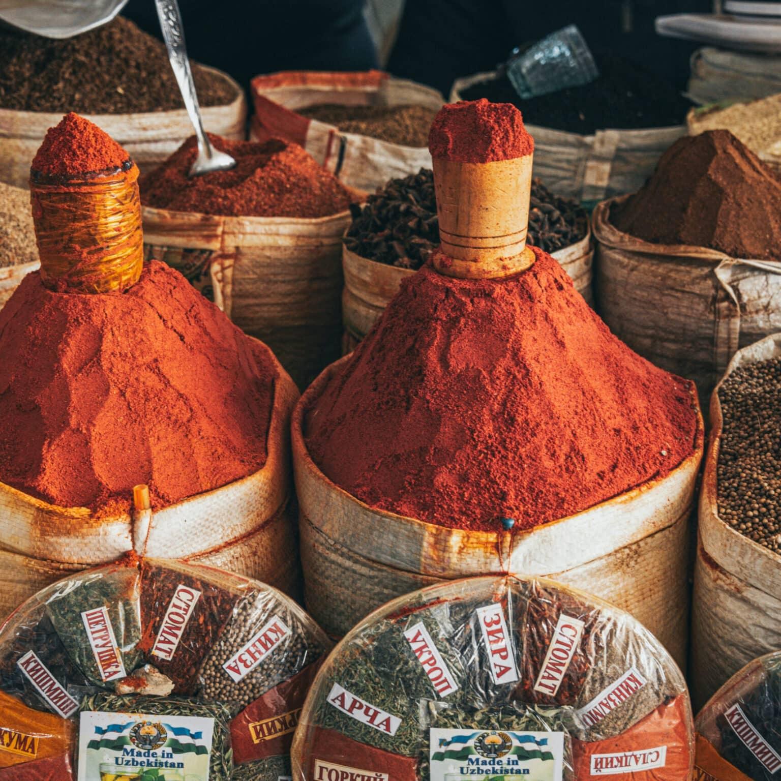 Colorful spice stacks at the Chorsu Bazaar in Tashkent with various spices