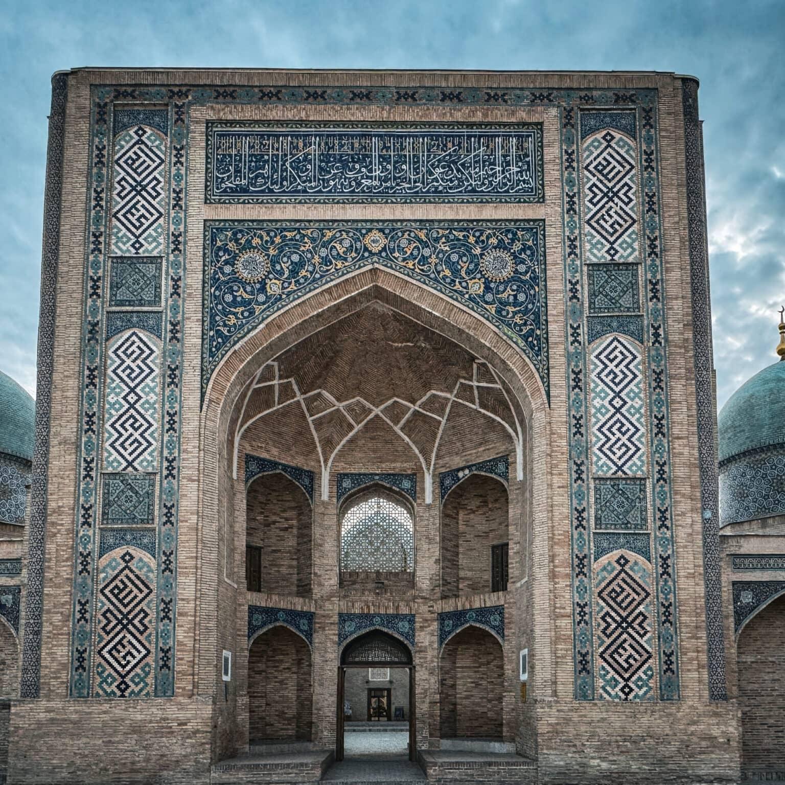 Exterior view of the Barak-Khan Madrasa in Tashkent with dome and decorative arches