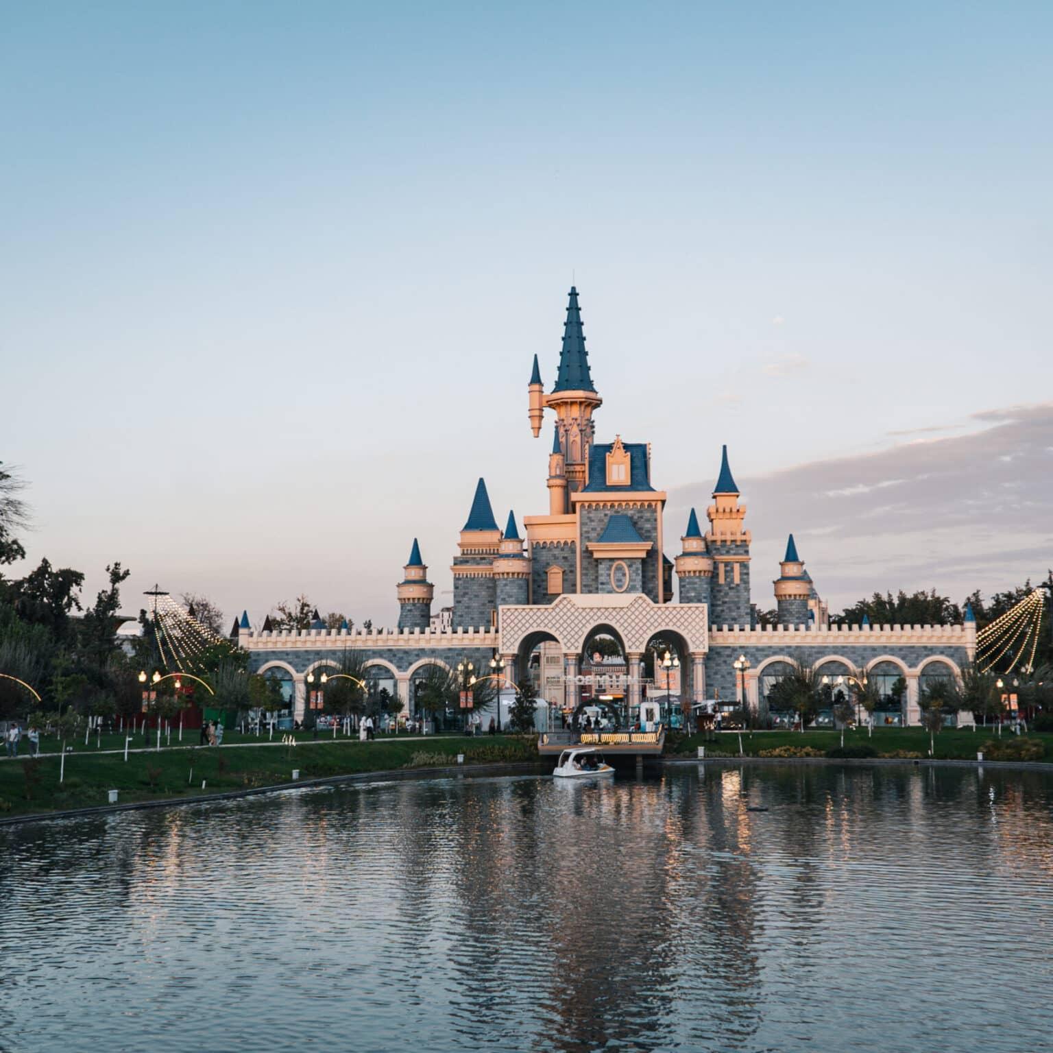 View of the castle in Magic City in Tashkent surrounded by a lake