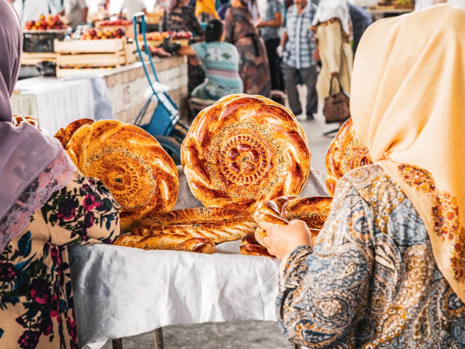 Women at the Chorsu Bazaar in Tashkent selling traditionally baked non-bread