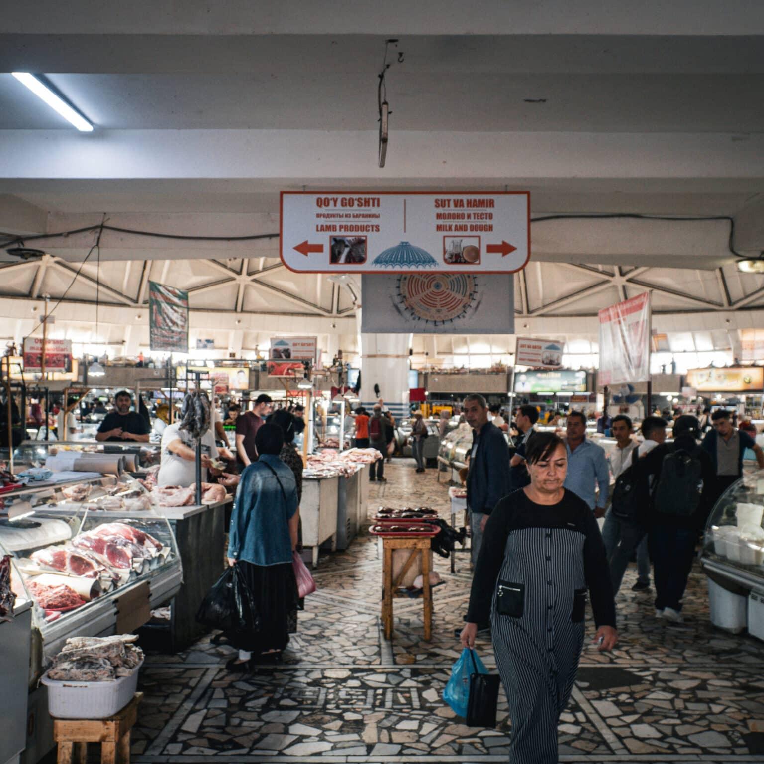 Interior view of the market hall of the Chorsu Bazaar in Tashkent with stalls for meat and dairy products