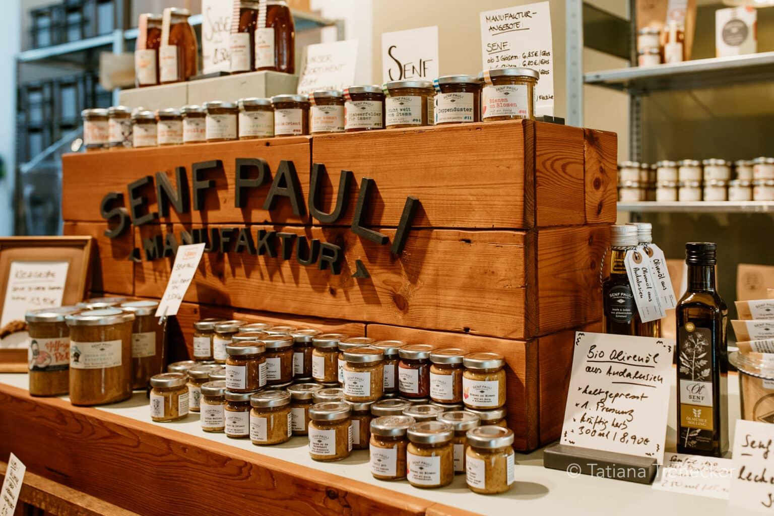 A display shelf with various jars at Senf Pauli in Hamburg.