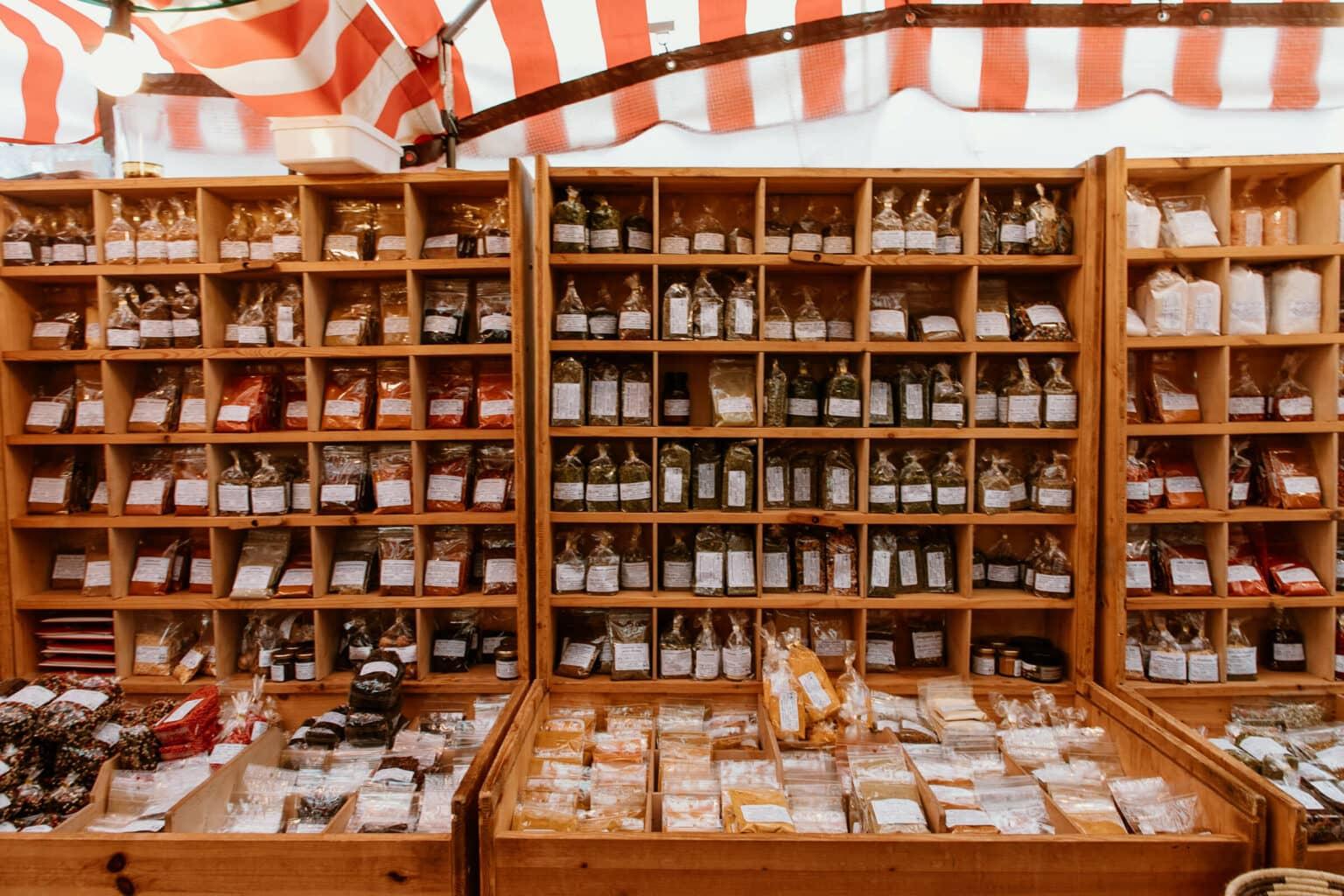 Various spices in plastic bags at a stand on the Isemarkt in Hamburg.