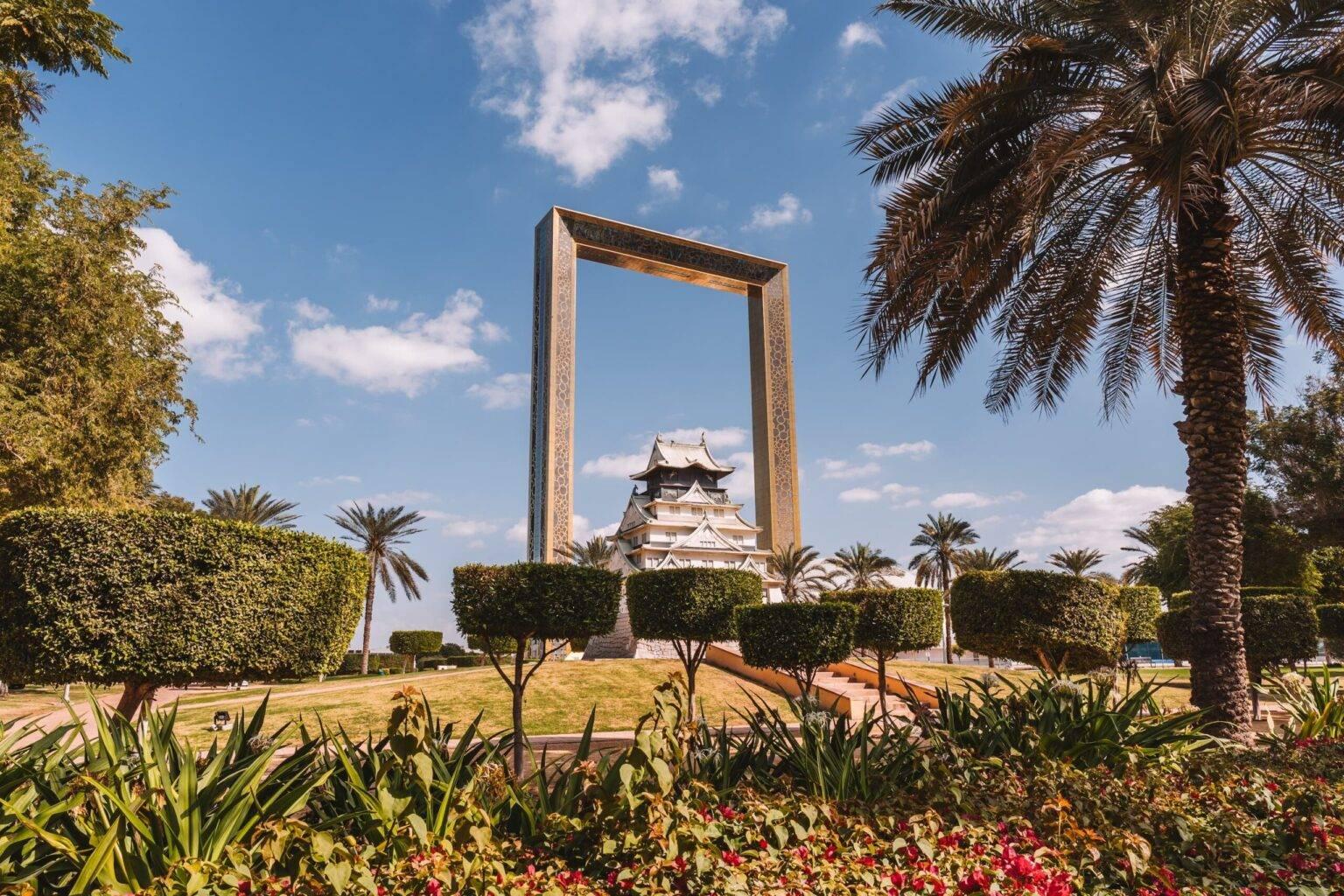 The Dubai Frame, an oversized picture frame with a building in the middle, surrounded by a park.