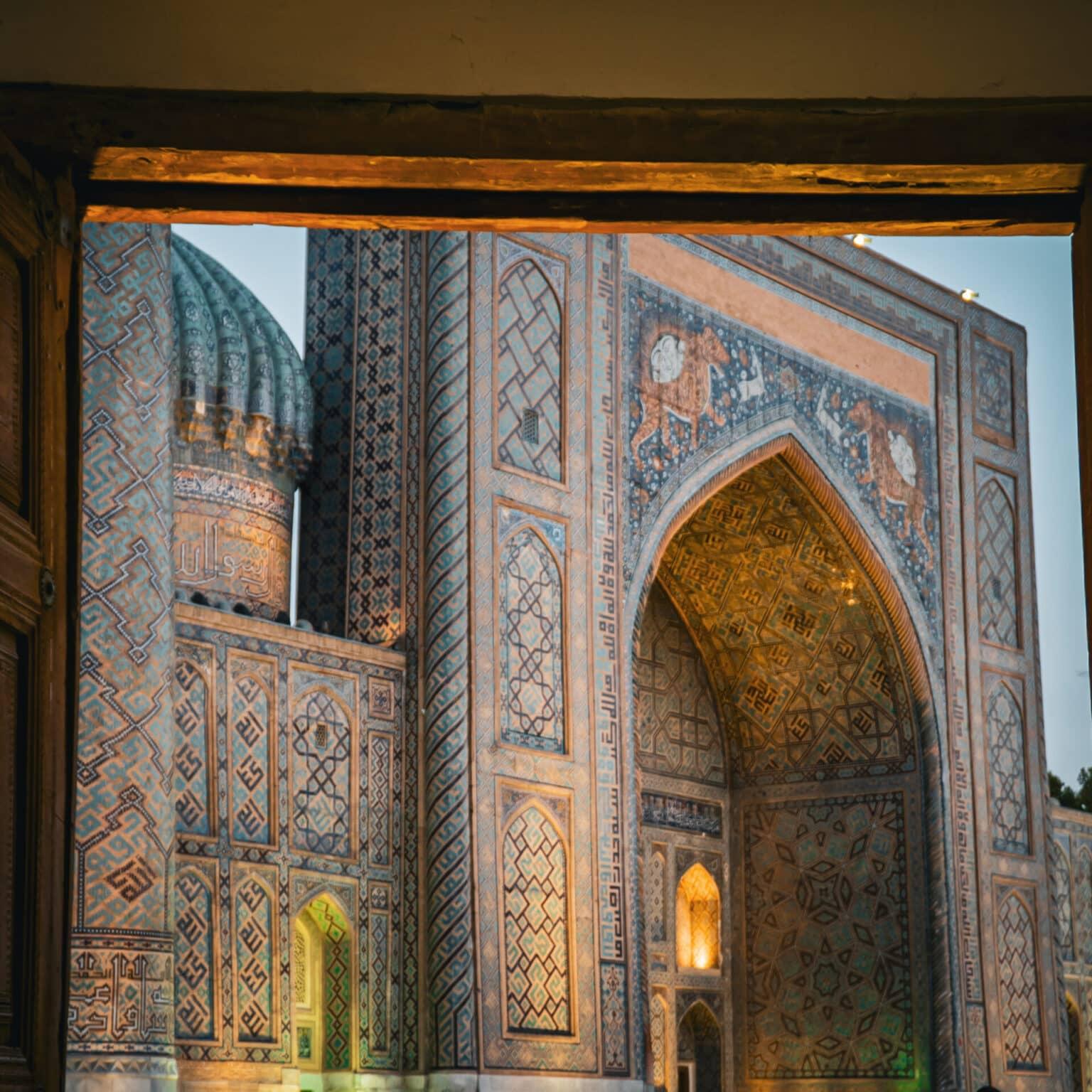 View of the Registan in Samarkand from a wooden door