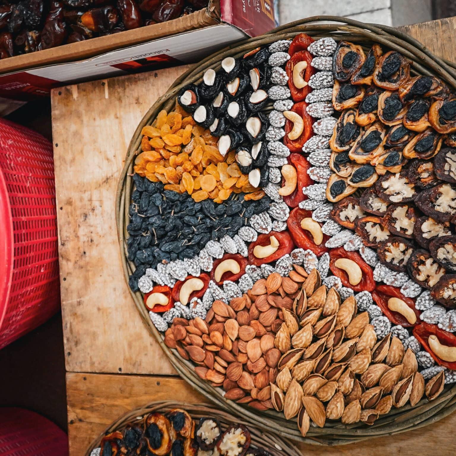 Finely arranged dried fruits, nuts, and almonds at the Siyob Bazaar in Samarkand