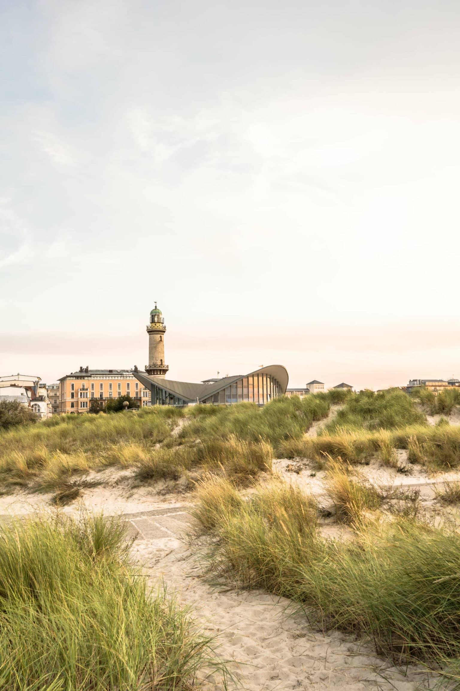 The Warnemünde lighthouse with the famous Teepott in the evening light.