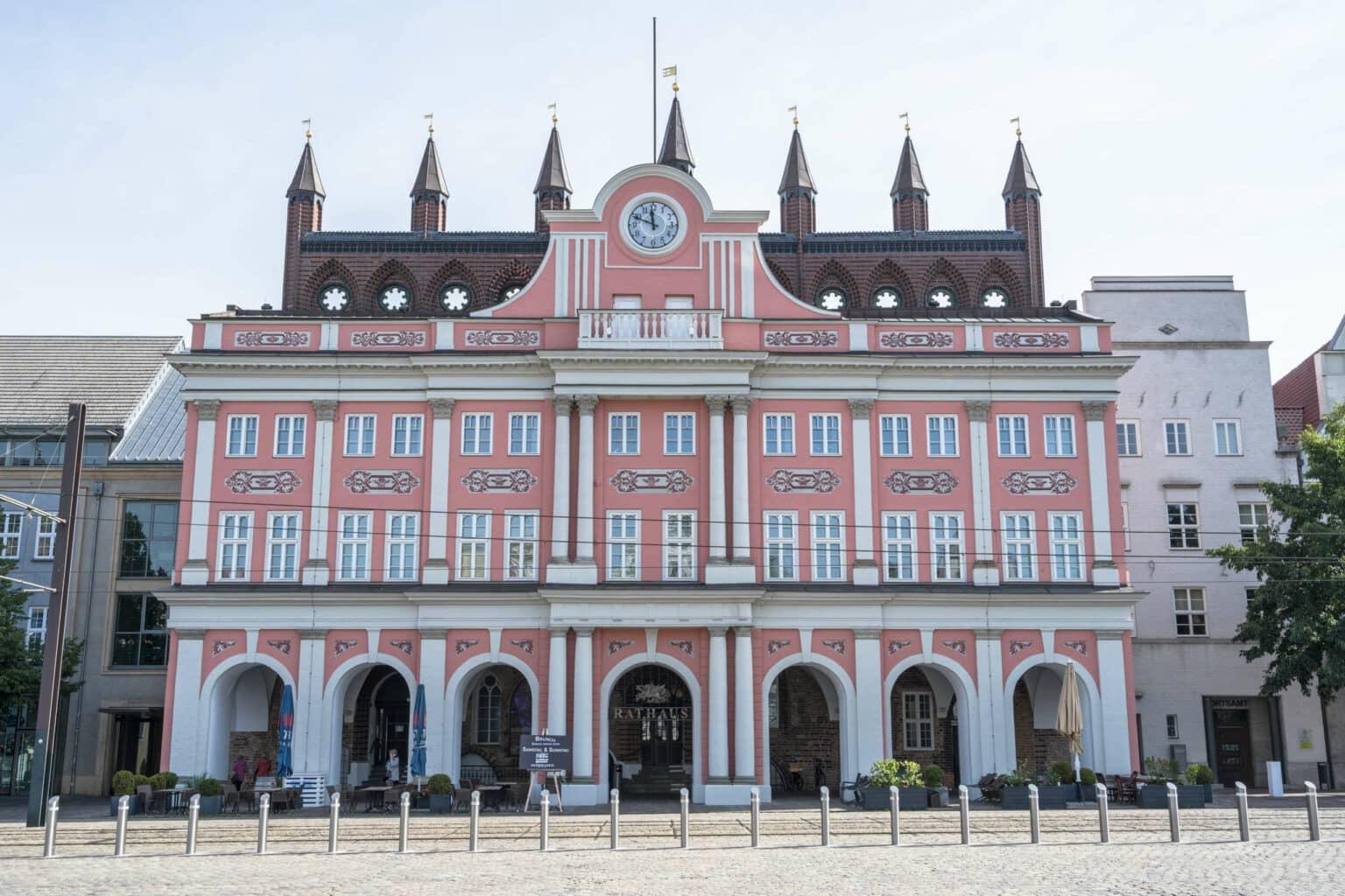 The Rostock Town Hall with its pink facade is a famous landmark in the city.
