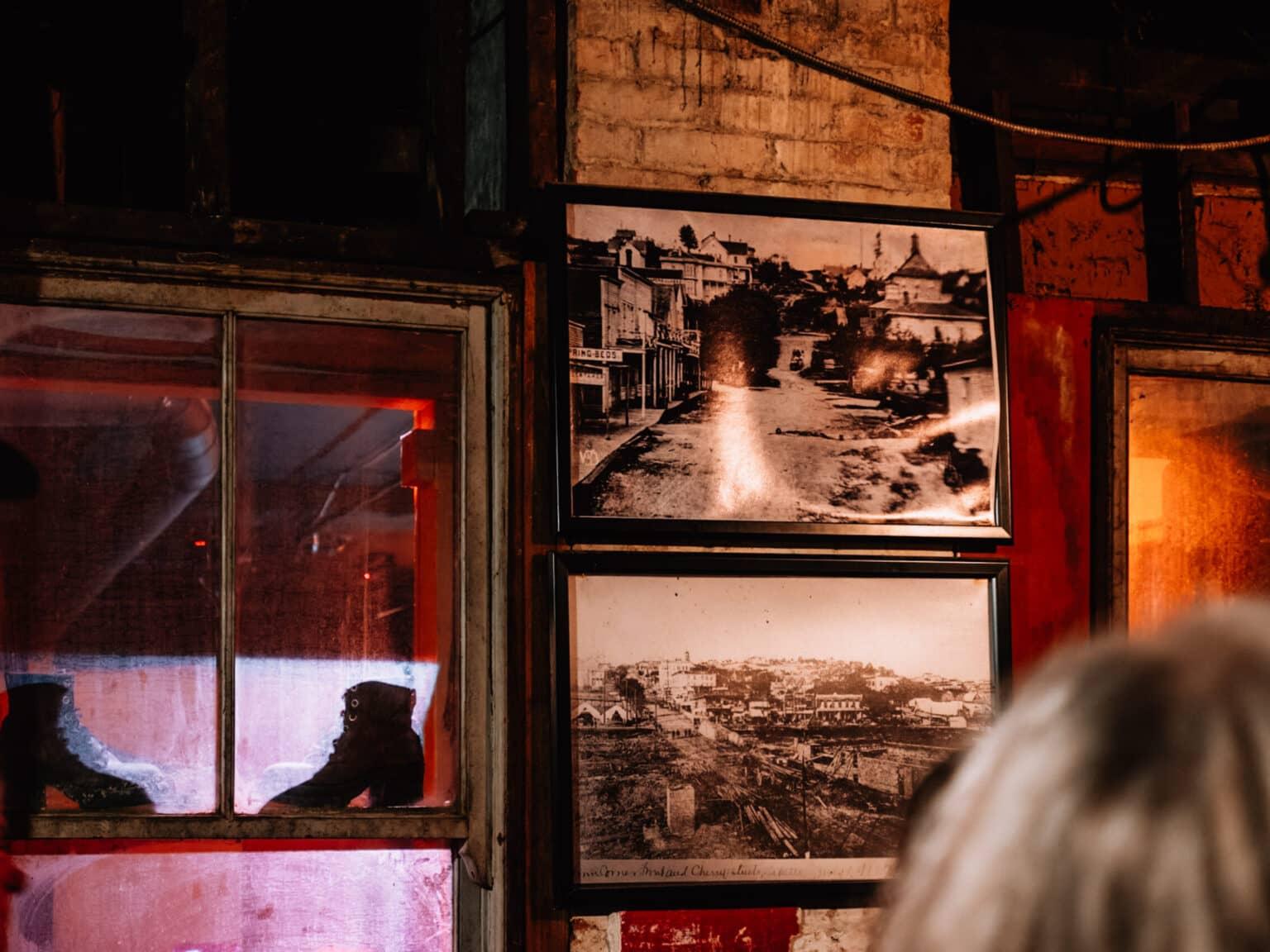 Photos of historic Seattle hanging on a wall.