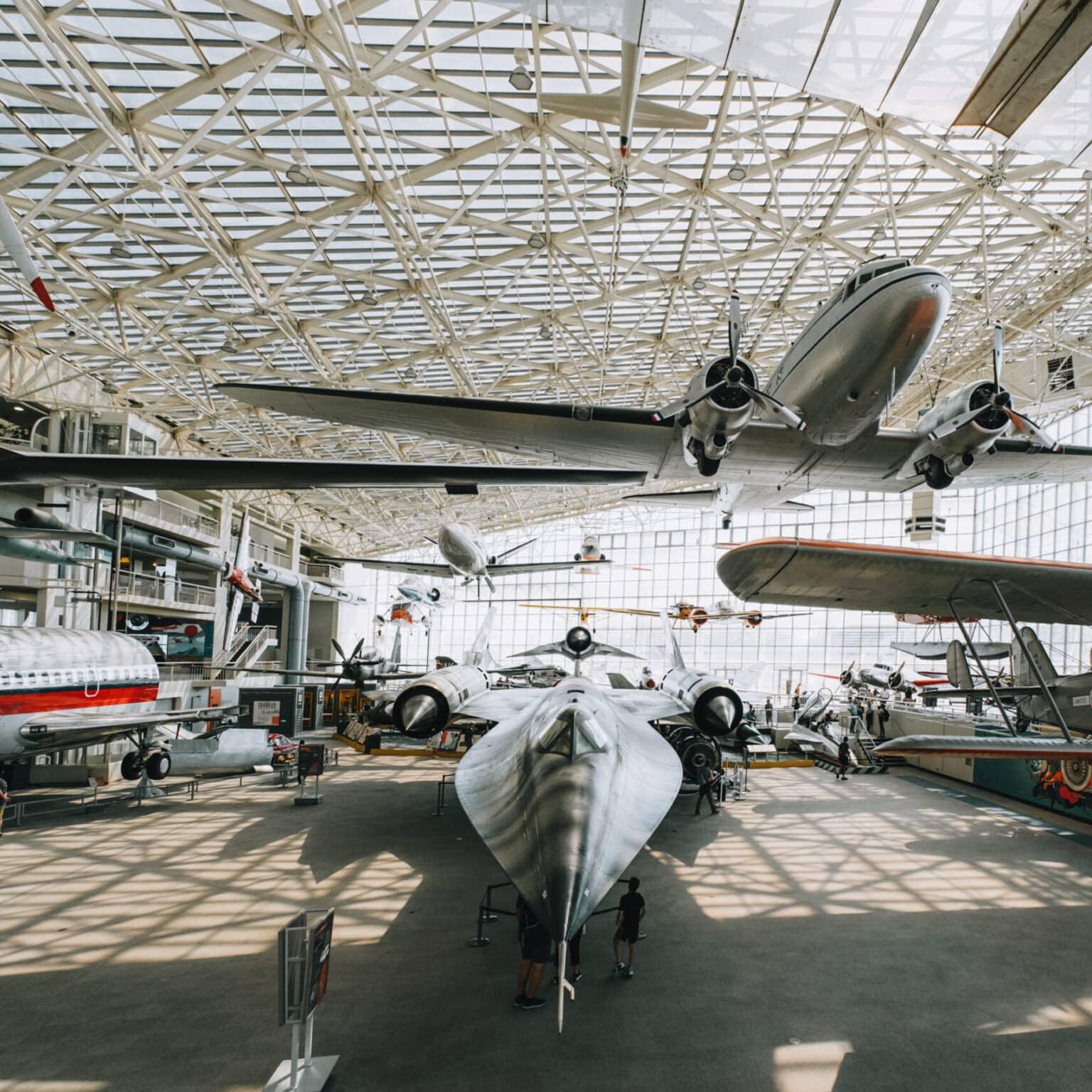 Various airplanes in an exhibition hall at the Museum of Flight.