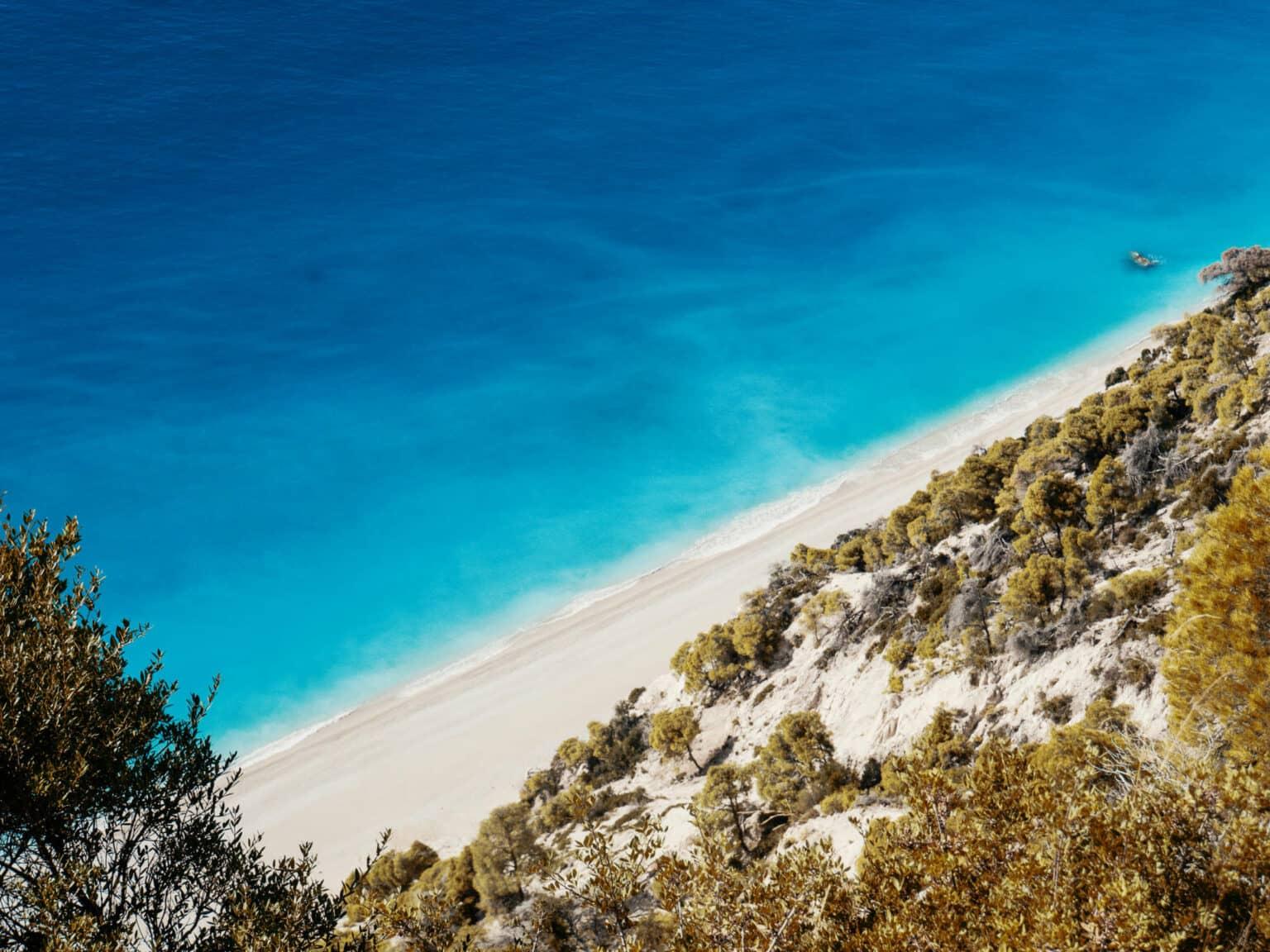 View from above, the water around the Greek island of Lefkada sparkles in an even deeper blue - a dream for any vacationer.