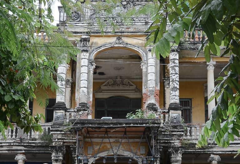 Behind Sisowath Quay, the overgrown and dilapidated villa The Mansion used to serve as a police station and later as a bar in Phnom Penh, Cambodia.